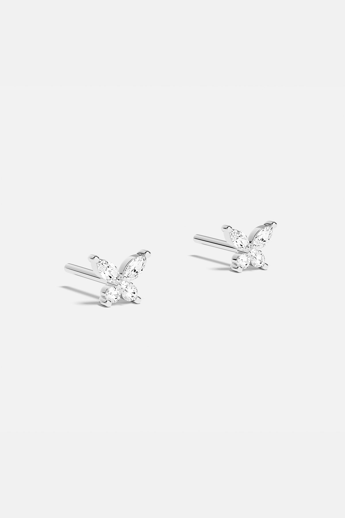 Earrings APM Monaco butterfly stud earrings in silver with gem-encrusted wings.