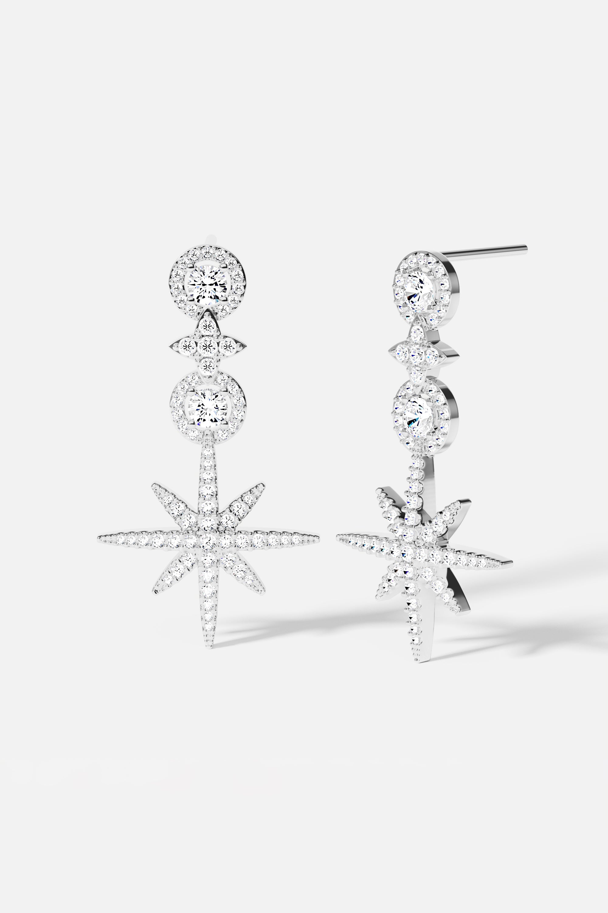 Earrings APM Monaco pavé circle drop earrings in white metal with crystal accents.