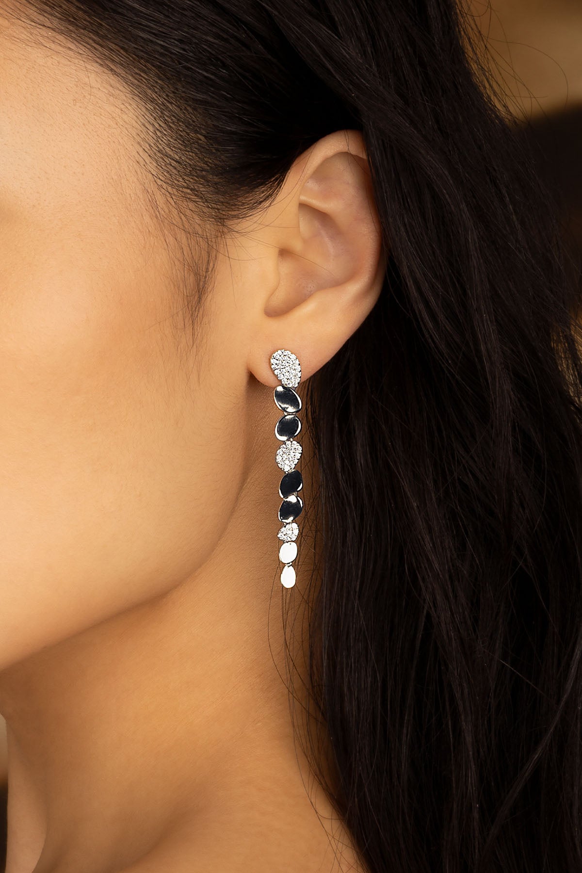 APM Monaco Galet Drop Earrings in Silver worn on ear