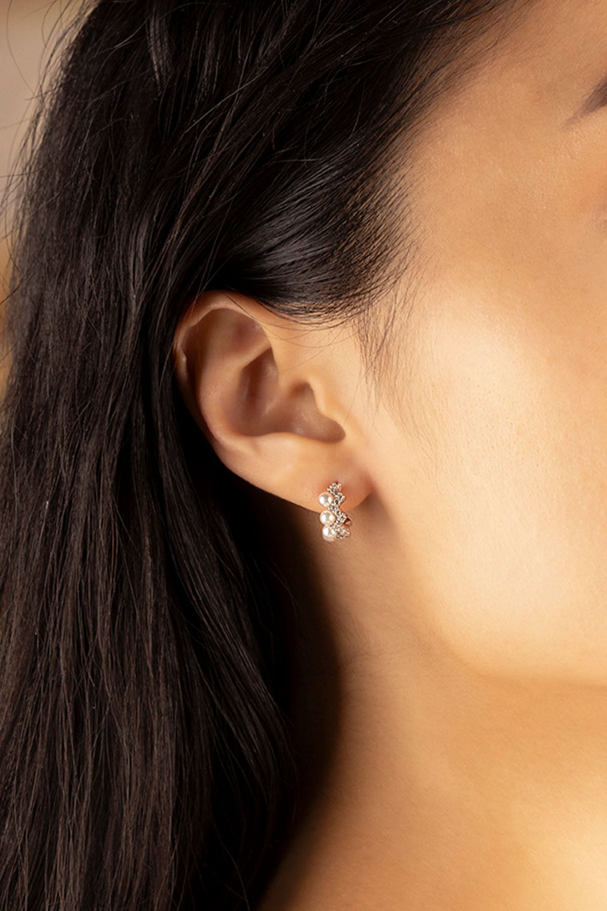 APM Monaco Up and Down Earrings with Pearls worn on ear