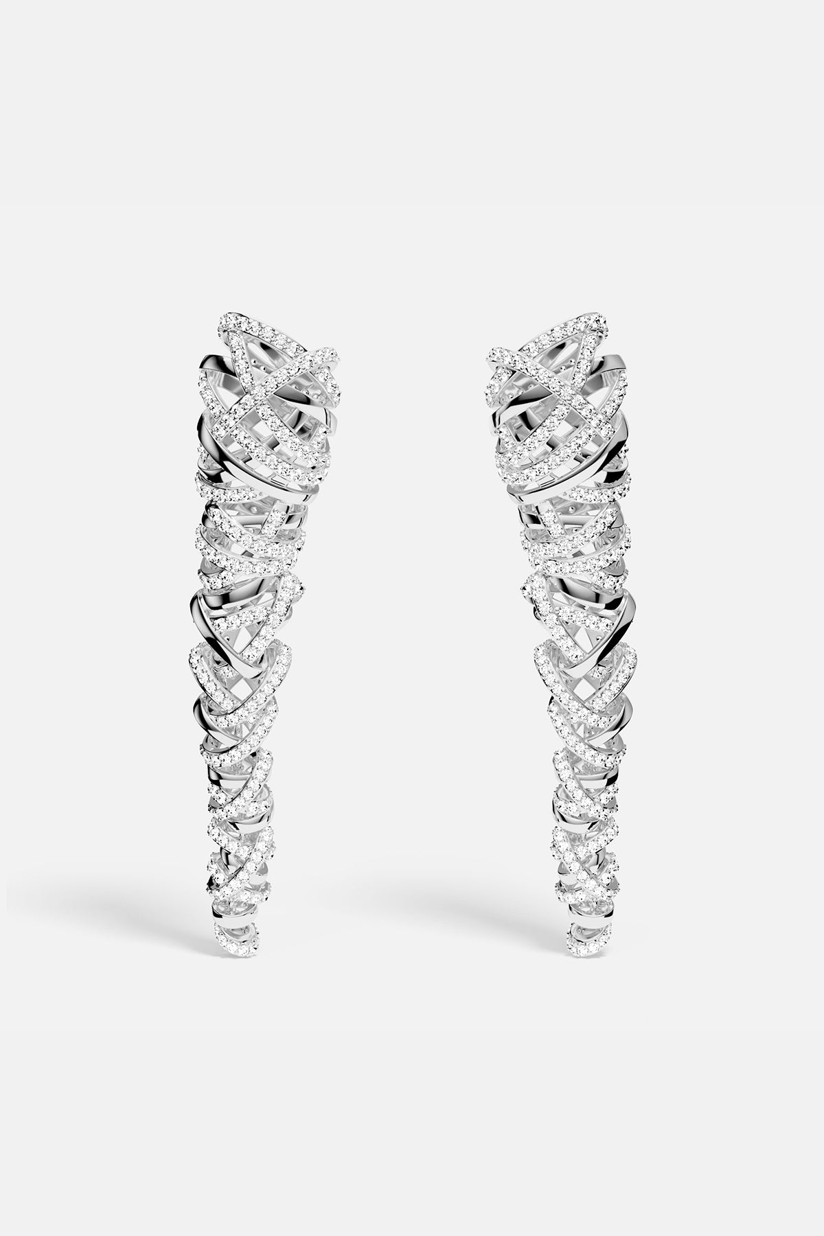 APM MONACO enlace drop earrings in silver on a white background