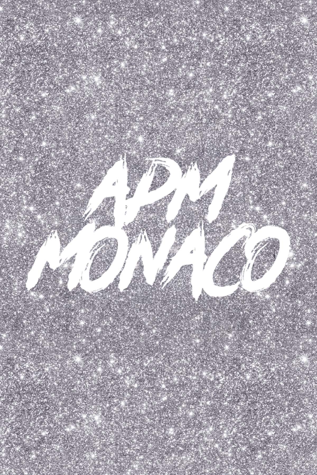 Glittery background with 'APM Monaco' text in white