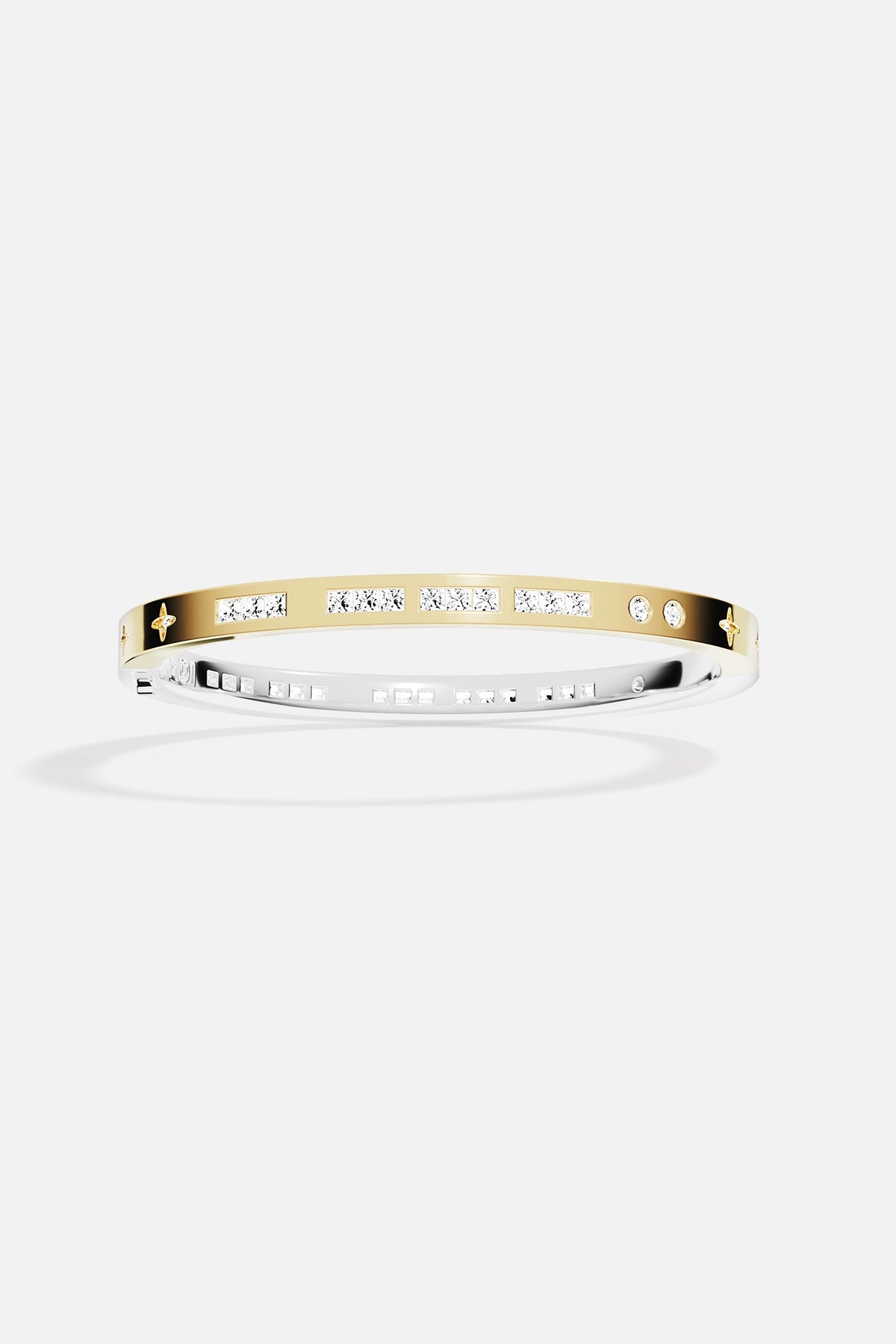 Gold bracelet with small stones on a white background