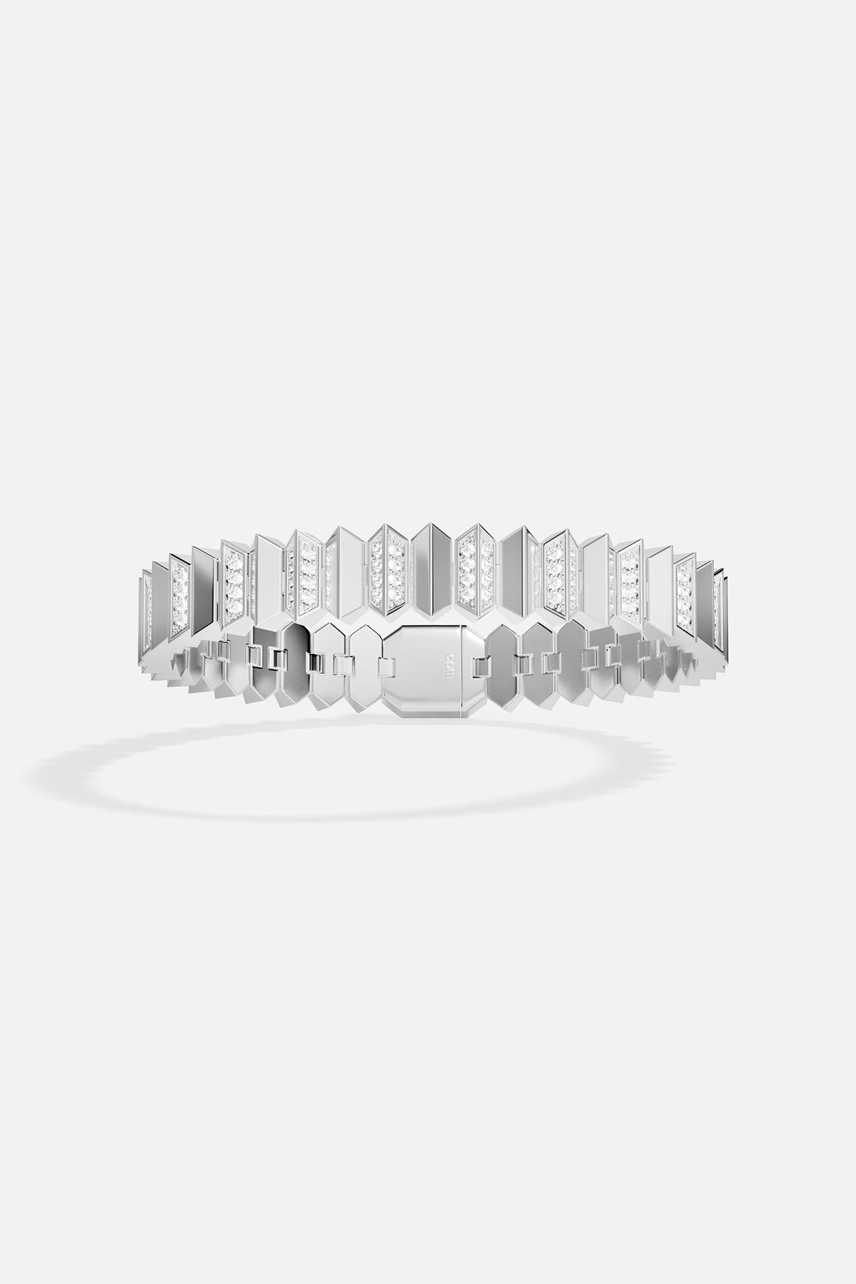Silver tone bracelet with geometric design on a white background