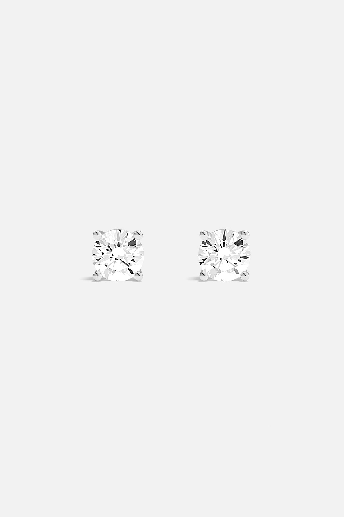 Earrings APM Monaco round stud earrings with white cubic zirconia.