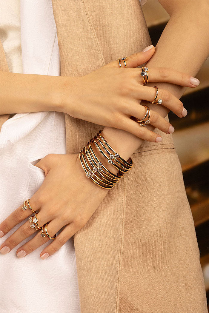 APM Monaco Éclat Cuff in Yellow Gold worn on hand