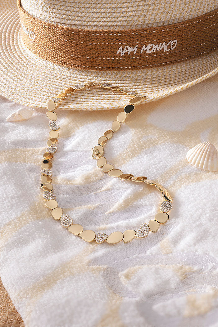 APM Monaco Galet Choker in Yellow Gold on soft blanket