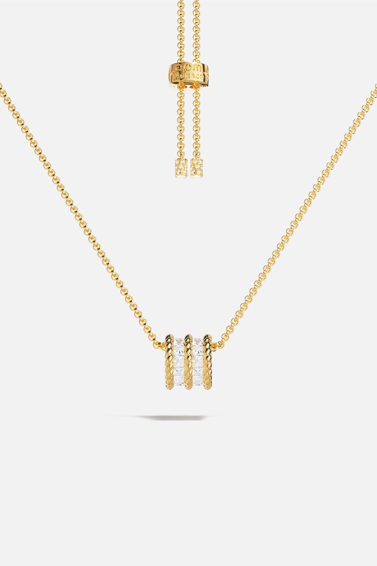 APM MONACO yellow gold adjustable necklace with white stones on a white background