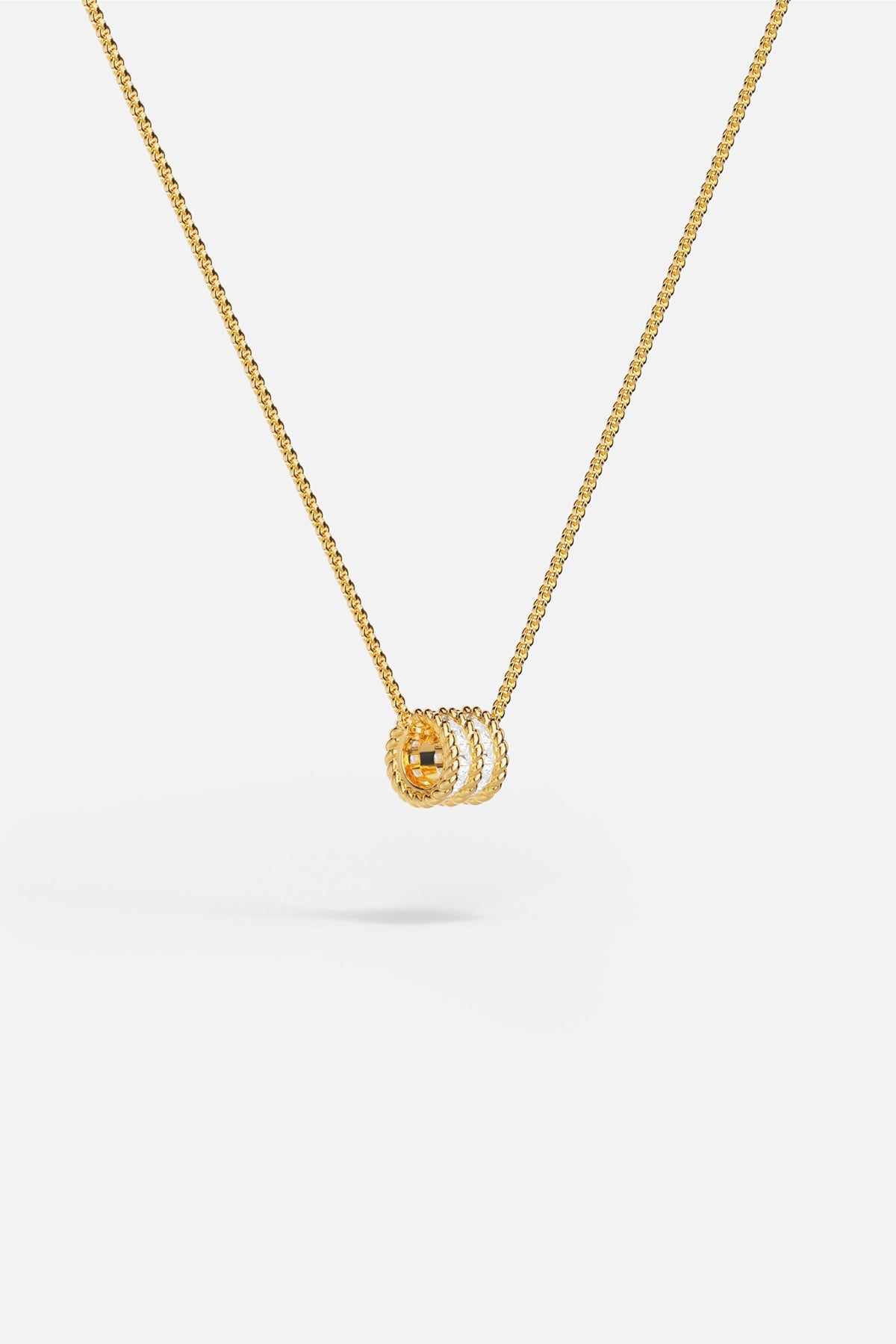 APM MONACO yellow gold adjustable necklace with white stones on a white background
