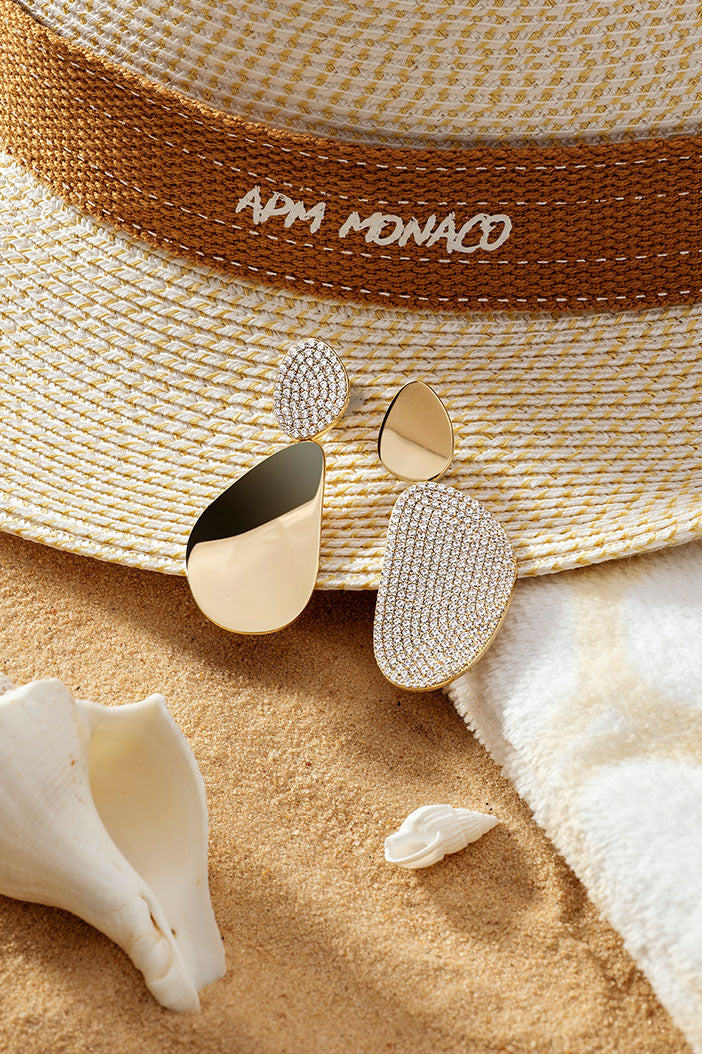 APM Monaco Galet Earrings in Yellow Gold on soft beach